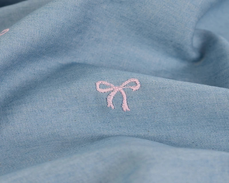 Light blue chambray with an embroidered denim bow